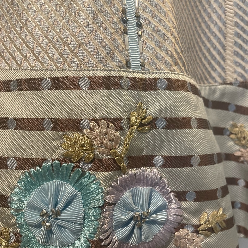 Beautiful silk skirt with added beading and design details.